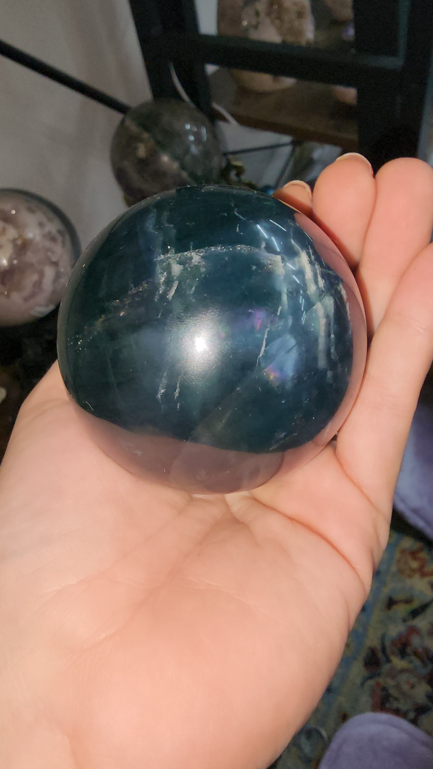 Blue fluorite crystal sphere many crazy rainbows