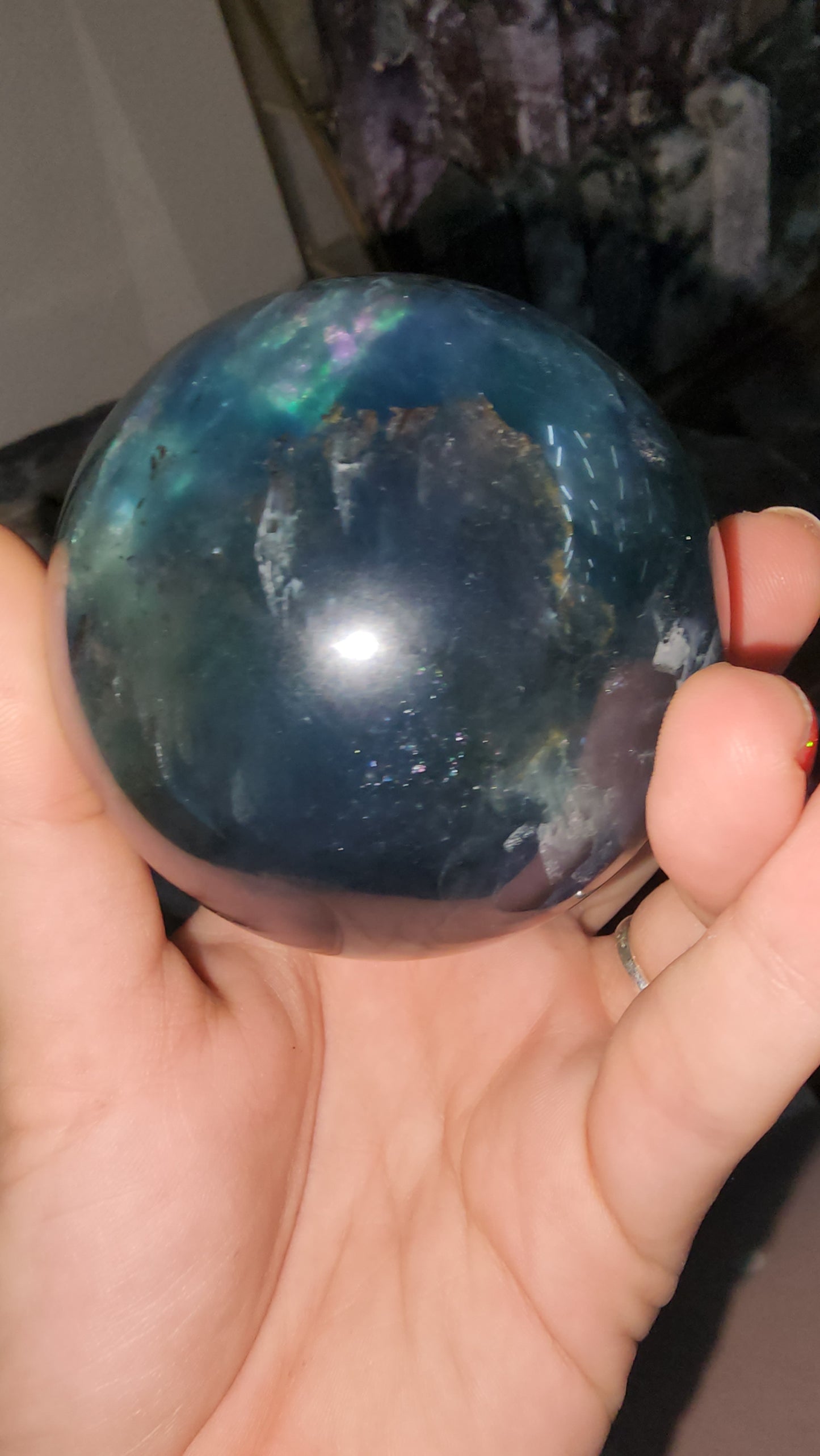 Blue fluorite crystal sphere many crazy rainbows